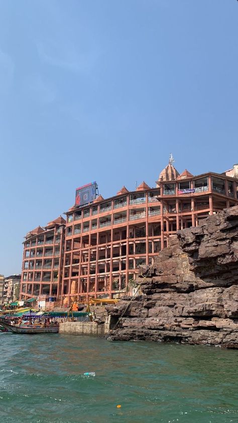 Omkareshwar riverfront temple buildings beside the Narmada